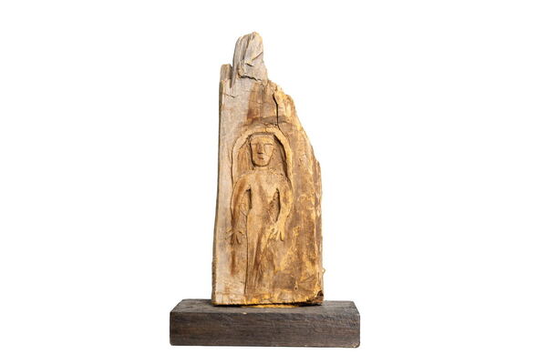 Carved Wood Figure on Weathered Slab