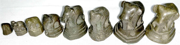 Eight Bronze Opium Weights in Elephant Form