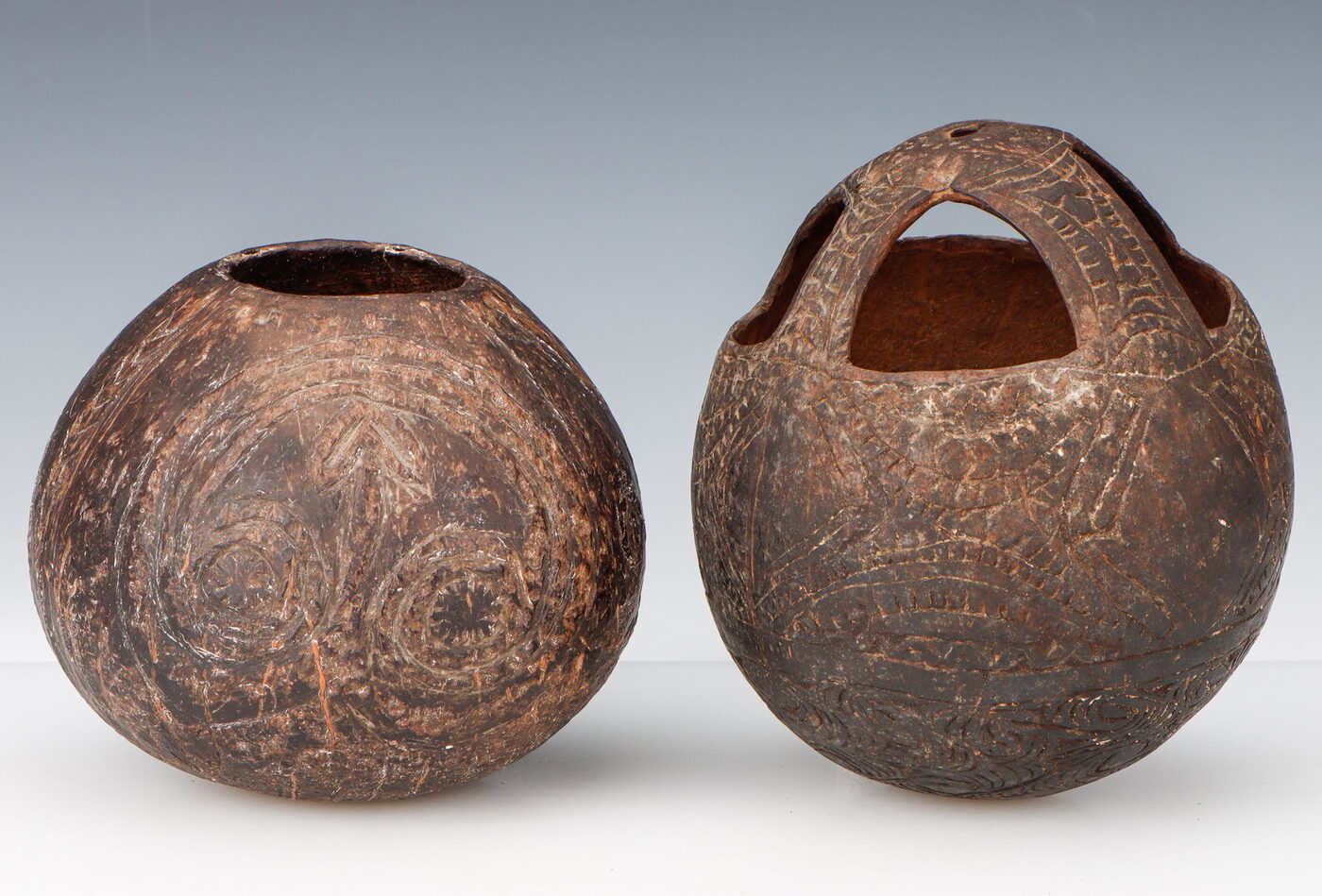 Two Iatmul Carved Coconut Shell Vessels