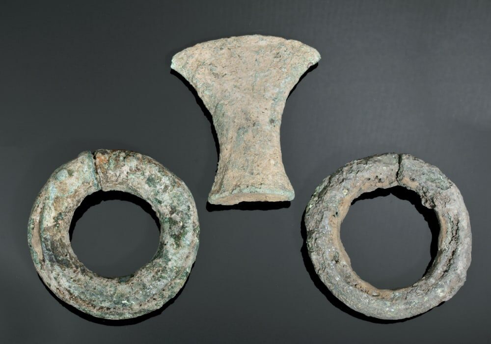 Two Dong Son Bronze Bracelets and an Axe Head